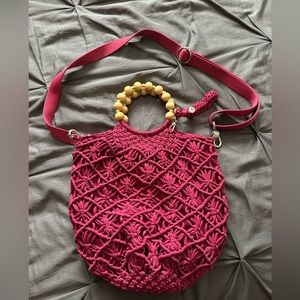 The Sak fuchsia crochet hobo purse with wooden bead handles